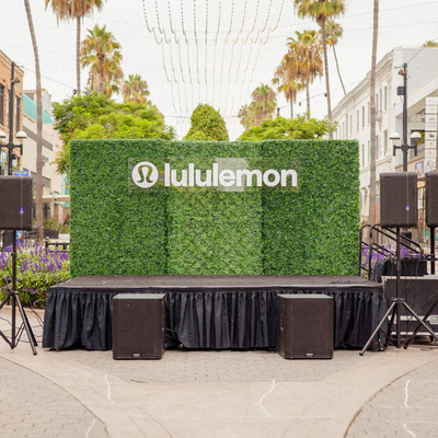 lululemon branded stage and hedge wall at a Motion LA experiential marketing brand activation in Los Angeles